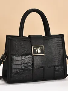 Classic black patchwork tote bag with crocodile texture and golden metal buckle lock