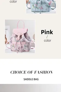 Close-up of pink floral backpack with metal buckle, drawstring closure and gold pendant