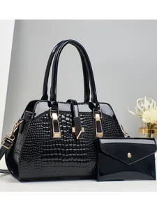 Black embossed faux crocodile leather handbag set with matching envelope wallet