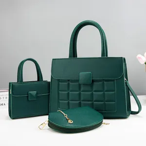 Three-piece dark green handbag set with square quilting and gold hardware accents