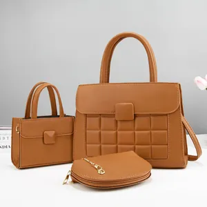 Detailed set of caramel textured leather bags with diamond quilting and chain detail