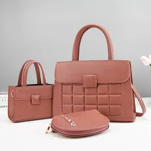 Three-piece women's quilted handbag set in dusty rose with pebbled leather texture