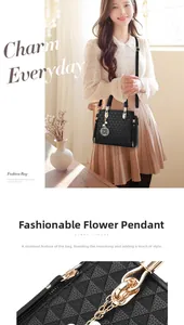 Detail of black tote bag with geometric texture and golden clover charm accessory