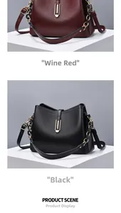 Détails des sacs seaux en cuir grainé bordeaux et noir avec ferrures dorées en U