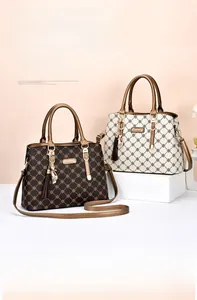 Detailed close-up of premium tote bags with floral patterns and luxury gold hardware