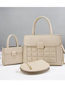 Three-piece set of beige lychee grain handbags with quilted patterns and gold hardware