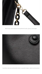 Détail du fermoir doré et de la texture en cuir grainé sur un sac à main noir