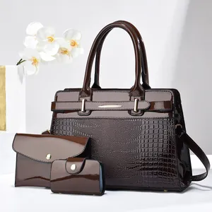 Three-piece dark brown tote bag set with crocodile texture and glossy finish