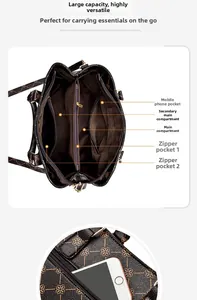 Detailed view of the handbag interior with two main compartments and a phone pocket