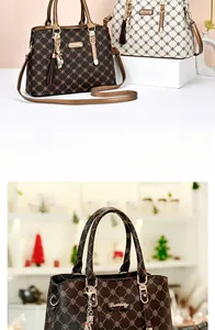 Close-up of geometric printed faux leather surface with cat pendant on crossbody bag