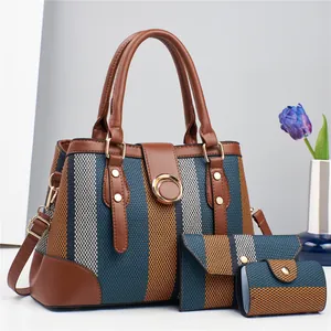 Three-piece striped canvas tote bag set with leather trim and gold round buckle