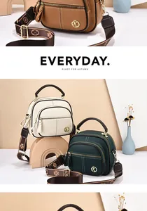 Detail of multi-pocket leather bags with metallic K logo and wide floral pattern straps