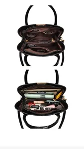 Internal view of a black crocodile-texture handbag showing spacious compartments and storage