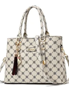 Floral print white leather shoulder bag with gold hardware and kitten charm accessory