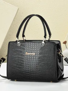 Elegant black crocodile texture tote bag with golden heart hardware for women