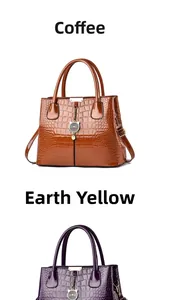 Detail view of glossy faux crocodile leather tote bags with metallic cat pendant charm