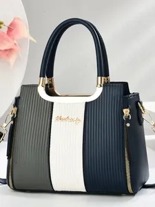 Vertical contrast color leather handbag with gold logo and textured stitching finish