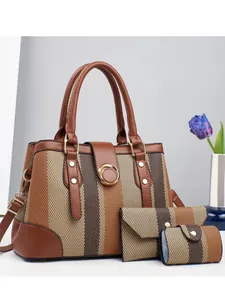 Three-piece women's handbag set with striped fabric design and gold ring hardware