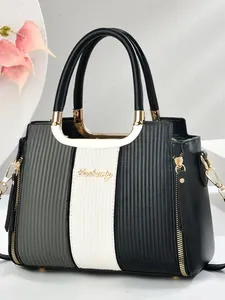 Minimalist tri-color leather handbag with vertical texture and gold metal accents