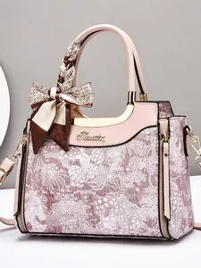 Elegant floral handbag with silk scarf handle and adjustable pink shoulder strap