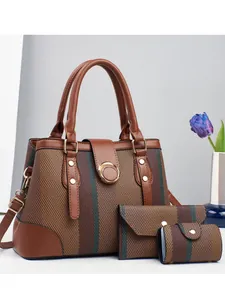 Three-piece women's handbag set featuring striped texture and gold hardware detailing