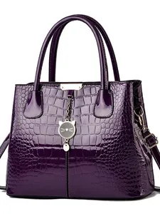 Dark purple faux crocodile leather tote bag with glossy finish and cat pendant charm