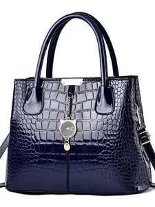 Navy blue faux crocodile skin handbag with top handles and a cute gold cat pendant