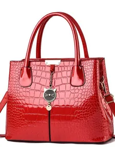 Glossy red crocodile texture handbag with cute cat charm and top handles