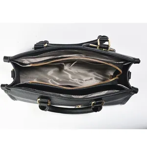 Top view showing multi-compartment interior with zipper pocket in black pebbled leather tote