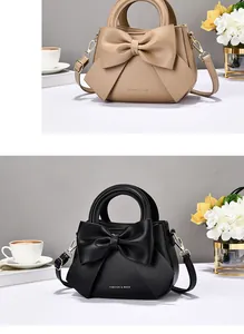 Detail view of stylish handbag featuring a large decorative bow and golden hardware