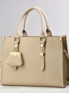 Beige lychee pattern PU leather tote bag with gold hardware and mini bag pendant charm