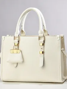 Chic beige lychee textured leather tote bag with gold hardware and mini charm