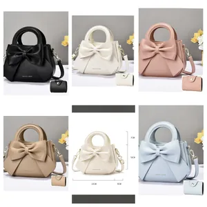 Detailed view of women bow handbag size specs and color options including mini wallets