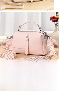 Pink pebbled leather crossbody bag with dual straps and silver metal zipper details