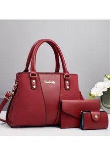 Three-piece red faux leather handbag set with shoulder bag, wallet and card holder