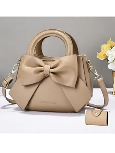 Elegant khaki handbag with bow decoration and matching small wallet in two-piece set