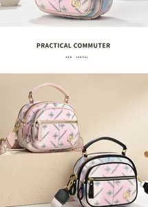 Close-up of printed cross-grain faux leather texture and golden metal logo on small handbag