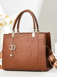 Brown crocodile pattern tote bag with vintage texture and wide geometric printed strap
