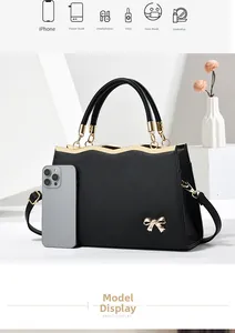 Crosshatch leather bag interior capacity detail showing space for iPhone and daily essentials