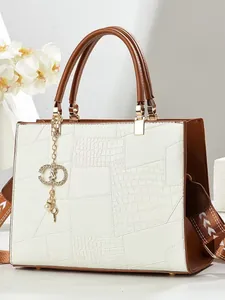 Vintage cream and brown embossed faux leather tote bag with crocodile texture and gold charms