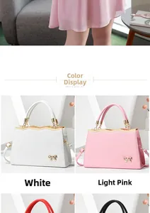 Detail showing various colors of women's tote bags with gold wave trim and bow ornament