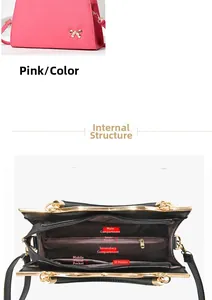 Detail view of the interior layout of the pink shoulder bag with multiple compartments