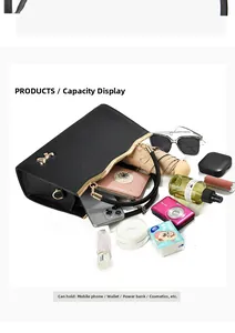 Detail view of large capacity black tote bag showing spacious interior with daily essentials