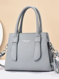 Grey textured leather handbag for women featuring a double handle and detachable strap