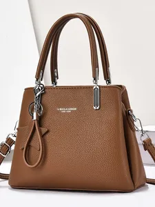 Brown lychee texture leather tote bag with silver hardware and star pendant