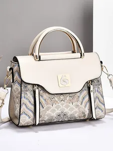 Minimalist embroidered crossbody bag with jacquard wave patterns and cream leather accents