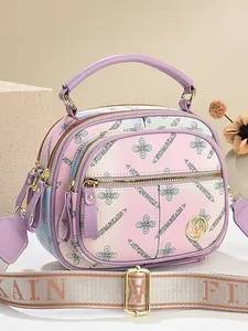 Multicolor floral print crossbody bag with wide strap and gradient purple design