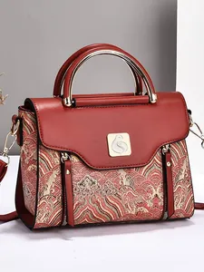 Red embroidered handbag with traditional cloud patterns and gold metal handles for women