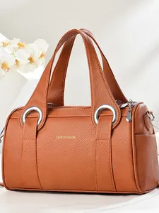 Caramel brown pebbled leather Boston bag with double top handles and silver hardware