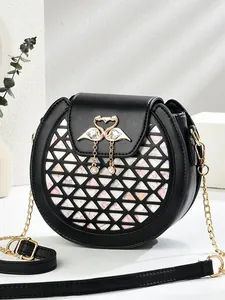 Elegant black circular chain bag with floral heart pattern and golden swan pearl clasp